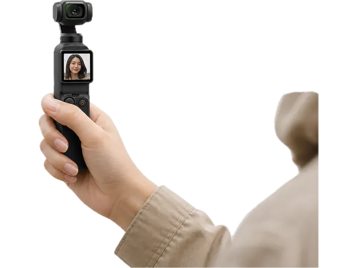 A creator filming outdoors with a handheld gimbal camera