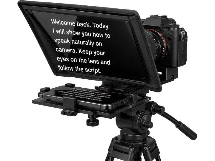 A camera teleprompter with a phone secured in the tray and readable English script reflected on the glass